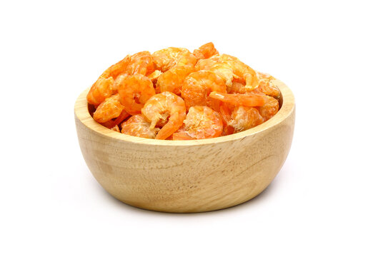 dried shrimp in wooden bowl isolated on white background.