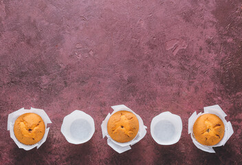 Tasty muffins on color background