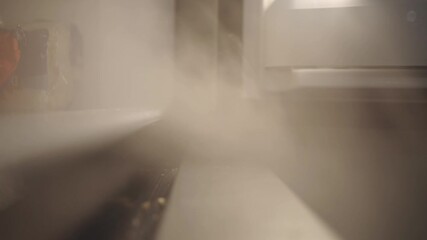 Cold Steaming Water Vapor Coming Out From The Freezer - Closeup Shot