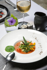 Healthy organic tomato soup. Modern creative restaurant meal. Exquisite dish, haute couture food.