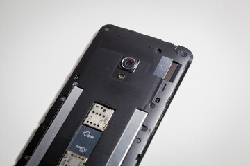 Smartphone with an open back cover. The smartphone is under repair.