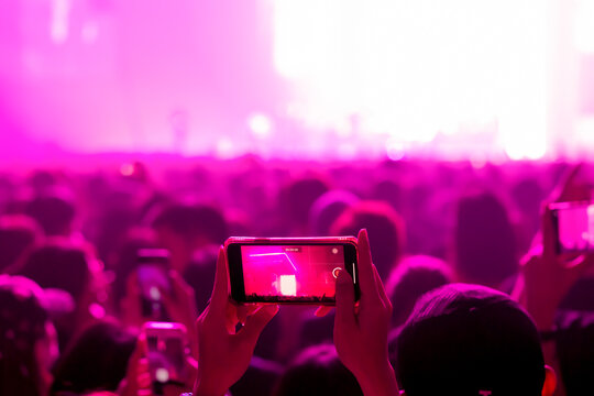 People shooting video or photo in music brand showing on stage or Concert Live, party concept