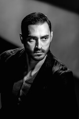 Obraz premium Bw portrait of fashionable young man with beard on dark background