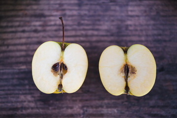 plant-based food, apple halves on wooden table