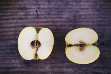 plant-based food, apple halves on wooden table