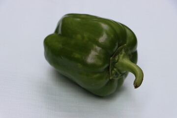 Fresh green capsicum or bell pepper isolated