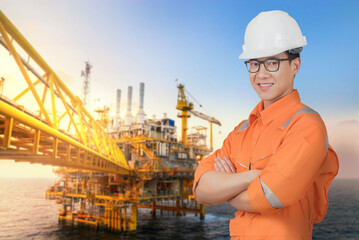 Asian confident and smart engineer man wearing coveralls suit and helmets for safety isolated on...