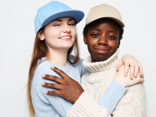 Multiethnic friendship concept. Cheerful European and African women.