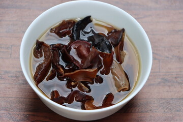 Rehydrated wood ear mushroom or black jew mushroom in white bowl, delicacy of Sikkim