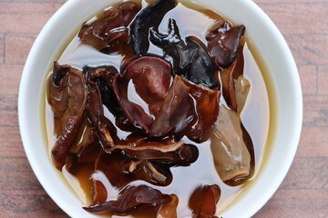Rehydrated wood ear mushroom or black jew mushroom in white bowl, delicacy of Sikkim