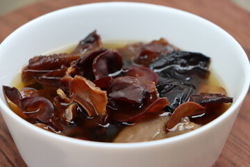 Rehydrated wood ear mushroom or black jew mushroom in white bowl, delicacy of Sikkim