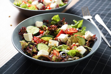 Tasty greek salad with fresh vegetables in a plate.