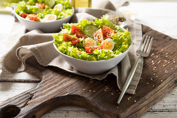 Tasty salad of fresh vegetables with quail eggs. Diet concept