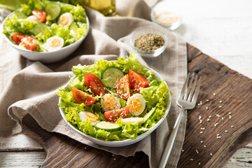 Tasty salad of fresh vegetables with quail eggs. Diet concept