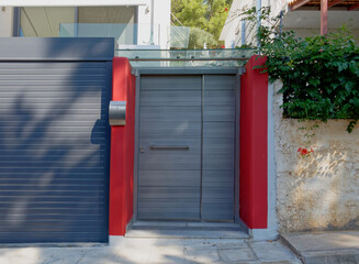 Naklejka premium modern design house red and grey entrance, Athens Greece.