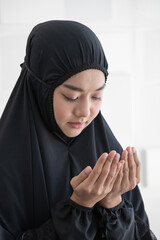 Asian muslim woman praying