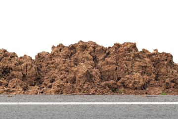 Isolate ground piles were dug and left on the side of the road.