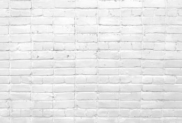 A close up of a white brick wall