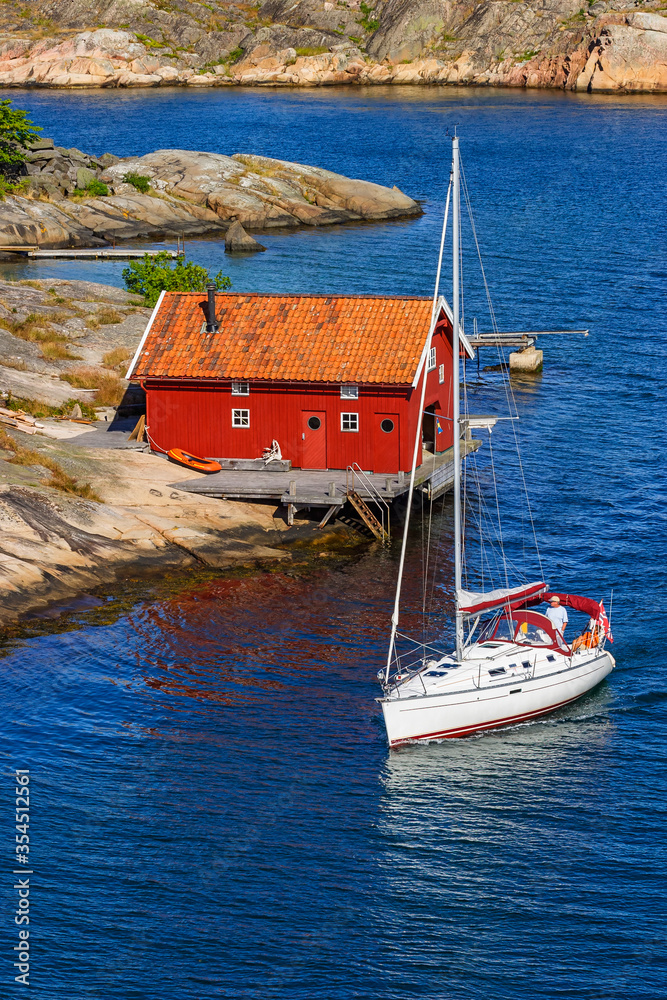 Canvas Prints Sailboat at an wooden boathouse at the coast