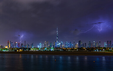 Night view of the Dubai city during lightning thunderstorm