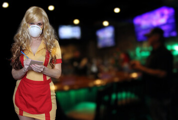 Waitress Wearing N95 Mask With Blurred Restaurant Background