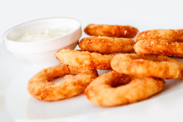 golden crispy Onion rings coated with breadcrumbs and deep fried