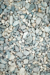 Pebbles near the ocean. Stones by the sea.