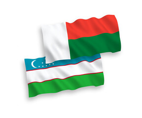 Flags of Madagascar and Uzbekistan on a white background