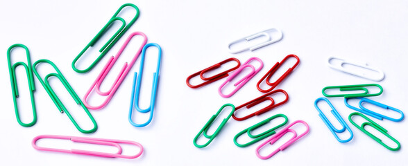 Colored paper clips close-up on a white background