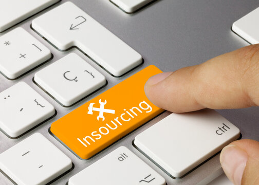 Insourcing - Inscription on Orange Keyboard Key.