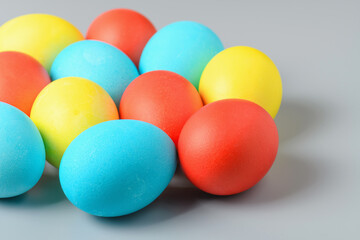 Colorful Easter eggs on a gray background. Easter eggs background. Easter eggs are a symbol and a mandatory attribute of the holiday.