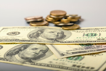 Cash banknotes and coins dollars background. Background of American money banknotes and coins.