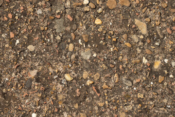 Close up of a lot of different sizes stones that are mixed with cement. The surface of pavement , flooring texture and background for web design and architect.