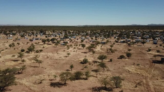 4K aerial drone video of Karibib, a small town in Erongo Mountains at B1 highway to west coast of Namibia and its township on hot sunny day in Erongo Region, central Namibia