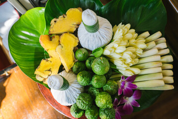 Set of Thai herbs and spa massage, ginger, herbal compress ball, lemon grass, kaffir lime leaves, Lemon leaves and Frangipani flowers