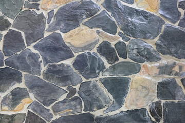 Black slate stone wall texture background