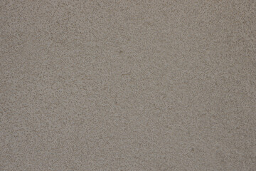 White concrete wall with grainy stucco.