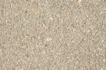 Close up of a lot of different sizes stones that are mixed with cement. The surface of wall, flooring texture and background for web design and architect.