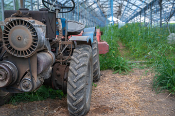 small old tractor for work in the field on an organic farm