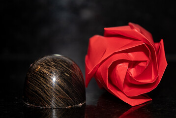 black and gold chocolate bonbon with origami rose 