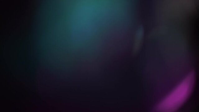 Police light beacon on a black background. Light leaks Pulsing and Glowing in 4K seamless loop. Police flashing light, Emergency lights flashing in the dark, Optical Lens Flare Effect.