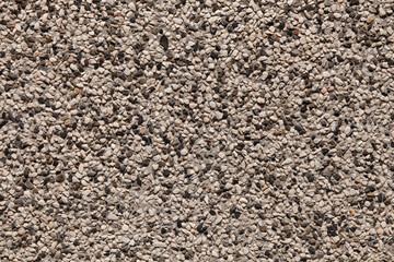 Close up a lot of small or tiny stones that are mixed with cement. The surface of concrete wall, flooring texture and background for web design and architect.