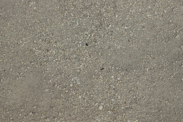 Gray gravel covering a dusty road in the countryside. Off road, long real modern travel
