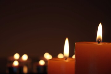 Candle black background of mourning funeral moment of silence