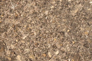 Close up a lot of small or different sizes stones that are mixed with cement. The surface of pavement , flooring texture and background for web design and architect.