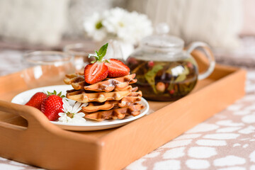 Delicious fresh baked belgian waffles with berries and fruit