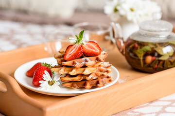 Delicious fresh baked belgian waffles with berries and fruit