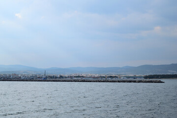 Cloudy seascape with Alexandroupolis harbour entrance