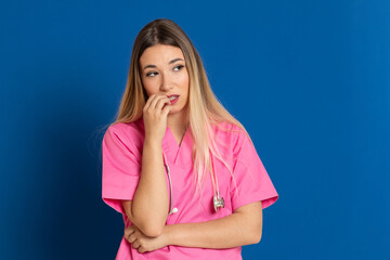 Blonde doctor with pink uniform