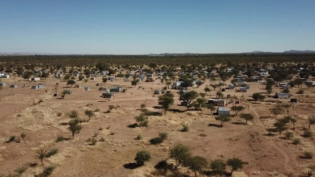 4K aerial drone video of Karibib, a small town in Erongo Mountains at B1 highway to west coast of Namibia and its township on hot sunny day in Erongo Region, central Namibia